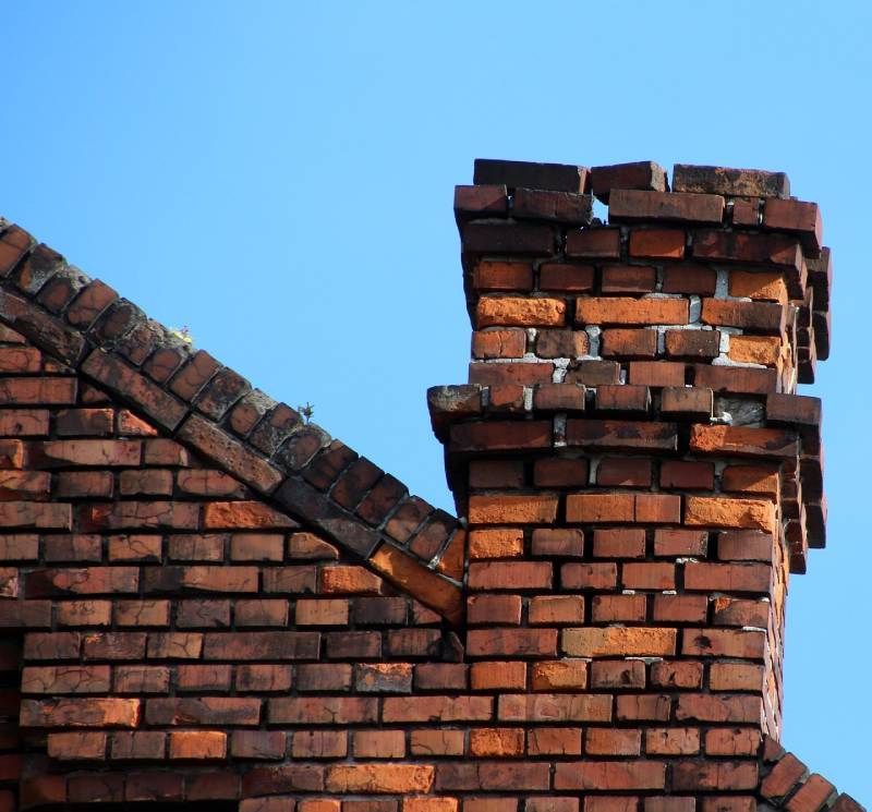 Signs Your Ijamsville Home Needs a Chimney Inspection Damaged chimney on an Ijamsville home showing cracks and missing mortar